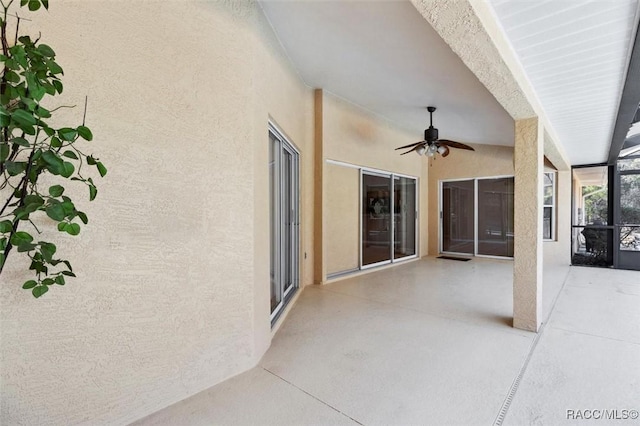 view of patio / terrace featuring ceiling fan and a lanai