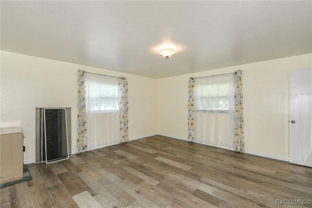 7 Michigan St, Beverly Hills, FL 34465 - empty room with wood finished floors and baseboards
