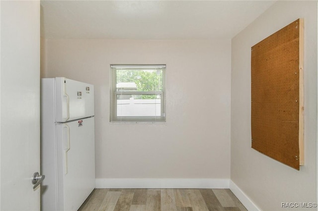 7 Michigan St, Beverly Hills, FL 34465 - kitchen with freestanding refrigerator and light wood finished floors