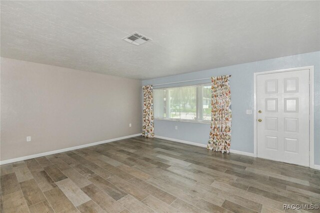 7 Michigan St, Beverly Hills, FL 34465 - unfurnished room featuring wood finished floors and baseboards