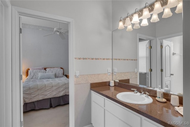 bathroom featuring ensuite bathroom, vanity, and a ceiling fan