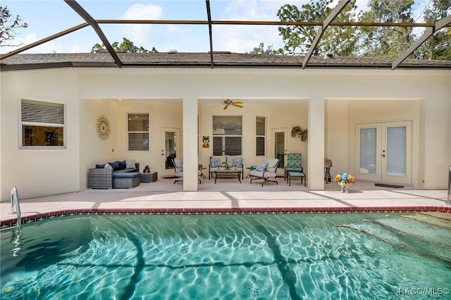 back of property featuring an outdoor pool, glass enclosure, an outdoor living space, and a ceiling fan