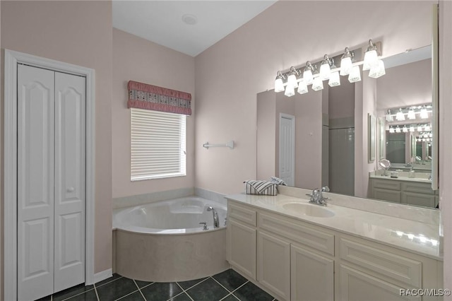 bathroom featuring a closet, tile patterned flooring, walk in shower, vanity, and a bath