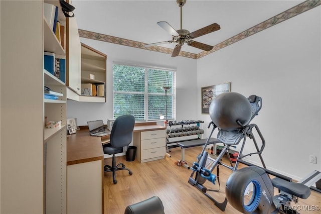 office with light wood finished floors and ceiling fan