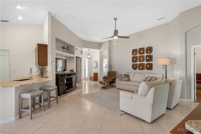 848 W Silver Meadow Loop, Hernando, FL 34442 - living room featuring arched walkways, ceiling fan, and light tile patterned floors