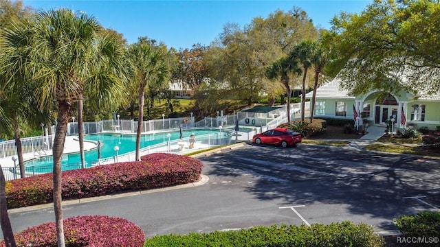 community pool featuring fence