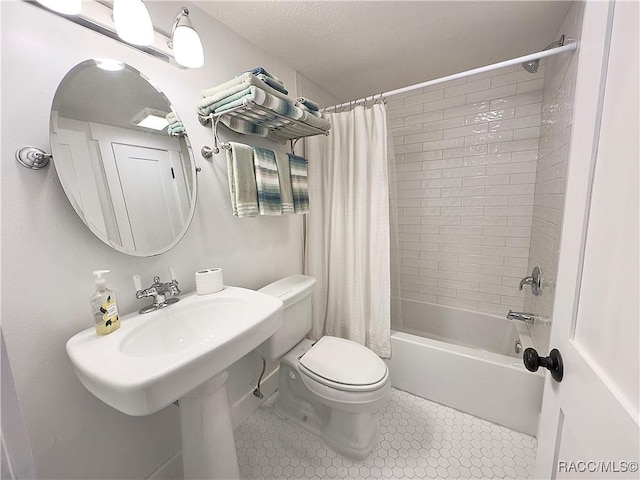 bathroom with shower / bath combination with curtain, tile patterned floors, and toilet