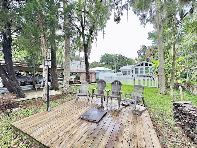 wooden deck featuring a yard