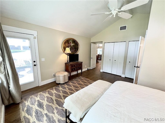 bedroom with lofted ceiling, access to exterior, ceiling fan, multiple closets, and dark wood-type flooring