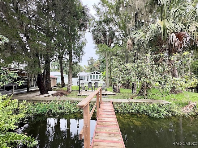 dock area featuring a water view