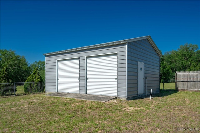 detached garage with fence