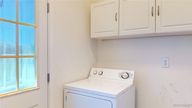 laundry room with washer / clothes dryer and cabinet space