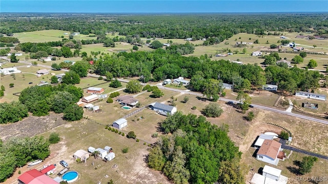birds eye view of property with a wooded view