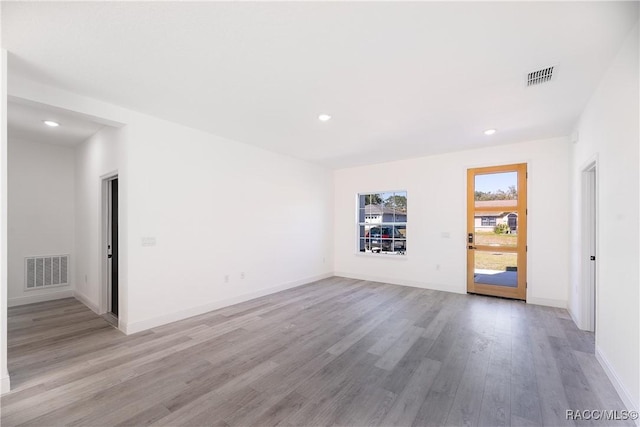 572 W Bluster Pl, Citrus Springs, FL 34434 - unfurnished room with light wood-style flooring and recessed lighting