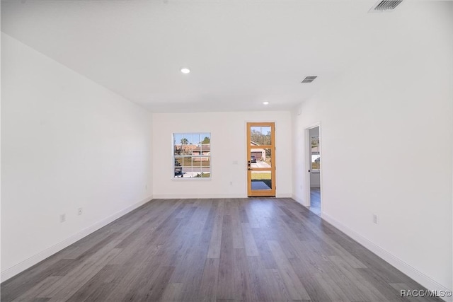 572 W Bluster Pl, Citrus Springs, FL 34434 - spare room with dark wood-type flooring and recessed lighting