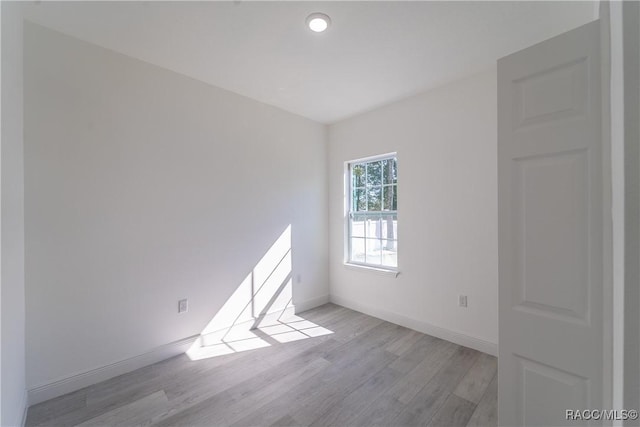 572 W Bluster Pl, Citrus Springs, FL 34434 - unfurnished room featuring light wood-type flooring and baseboards