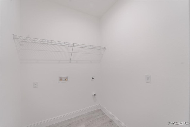 572 W Bluster Pl, Citrus Springs, FL 34434 - laundry room with electric dryer hookup, hookup for a washing machine, and light wood finished floors