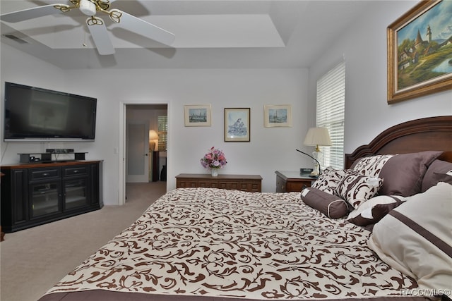 bedroom with ceiling fan and light carpet