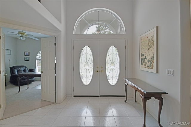 entryway featuring ceiling fan, high vaulted ceiling, and french doors