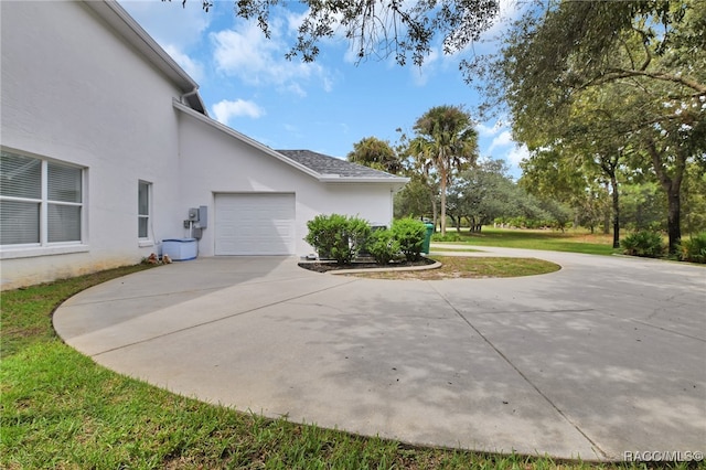 view of side of home with a garage