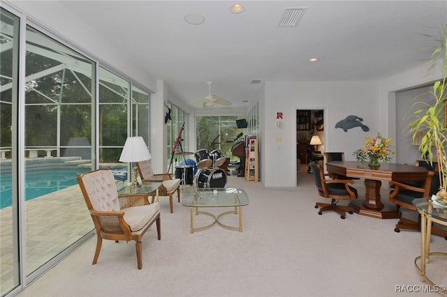 living room with carpet and ceiling fan