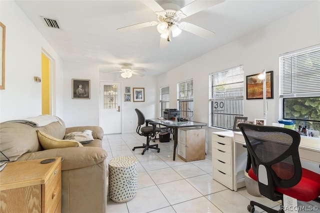 tiled office featuring ceiling fan