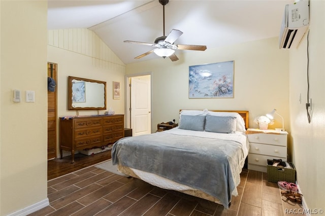 bedroom with ceiling fan, lofted ceiling, and a wall mounted air conditioner