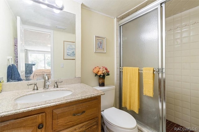 bathroom with a shower with door, a textured ceiling, toilet, and vanity