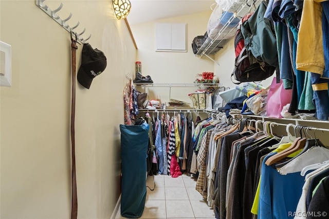 spacious closet with light tile patterned floors