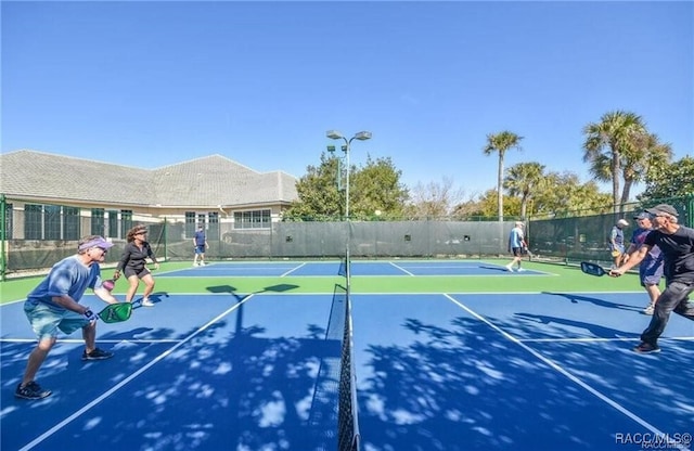 view of sport court featuring basketball hoop