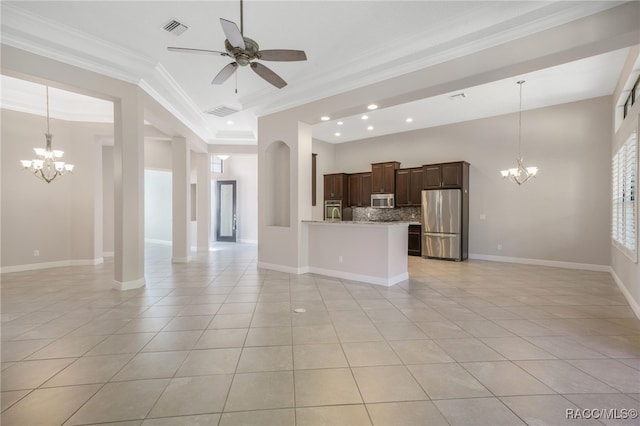 unfurnished living room featuring ceiling fan with notable chandelier, light tile patterned floors, and crown molding