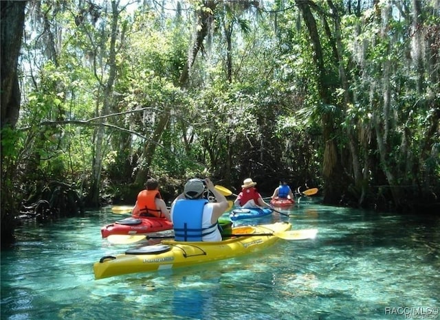 view of community with a water view