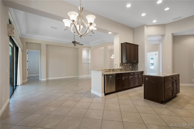 kitchen featuring decorative light fixtures, dishwasher, light tile patterned flooring, kitchen peninsula, and ceiling fan with notable chandelier