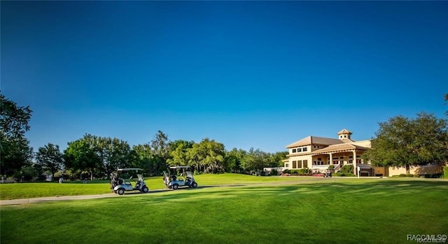 view of property's community with a lawn