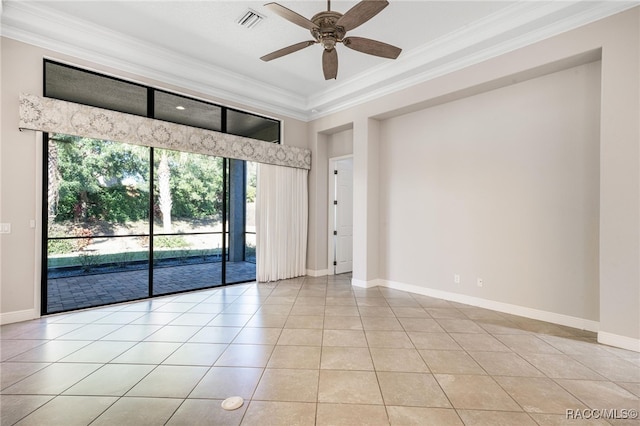 tiled spare room featuring ceiling fan, crown molding, and a healthy amount of sunlight