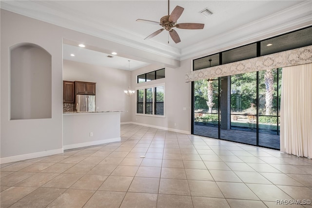 unfurnished room featuring ceiling fan with notable chandelier, ornamental molding, light tile patterned floors, and plenty of natural light