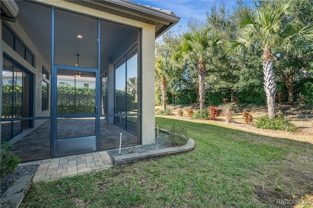 view of yard with a sunroom