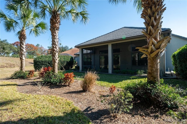 view of yard with a sunroom