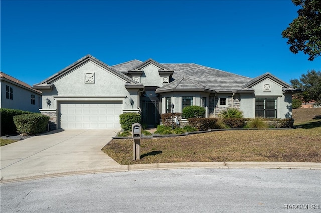 view of front of house featuring a front yard and a garage