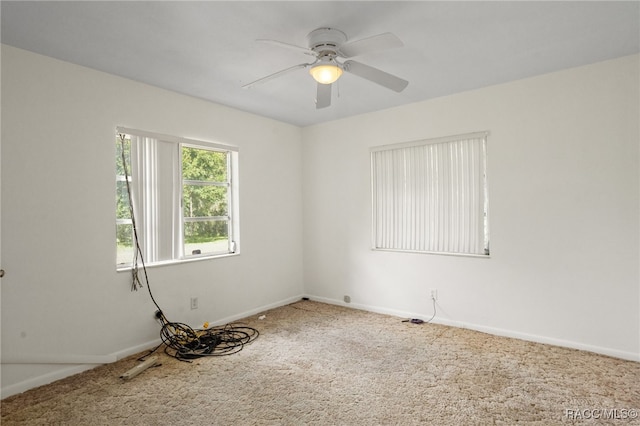 empty room with carpet flooring and ceiling fan