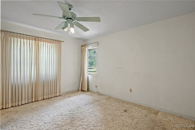 unfurnished room with carpet floors and ceiling fan