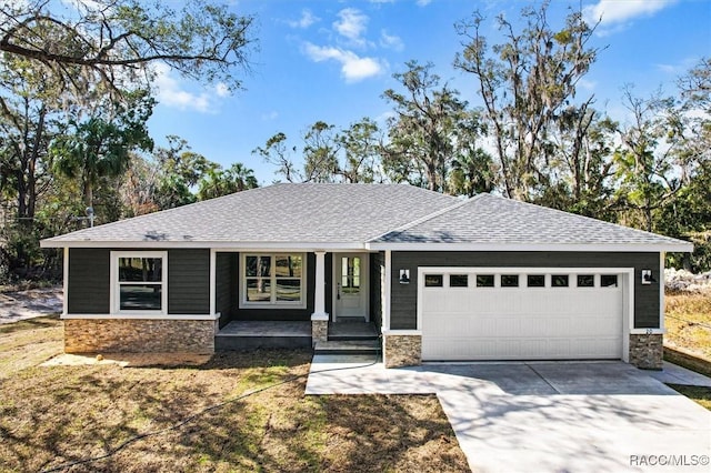 ranch-style house with an attached garage, stone siding, driveway, and a shingled roof