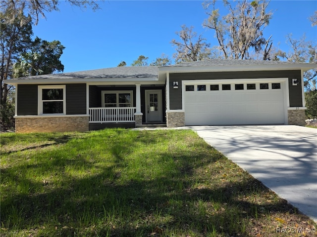 view of front of property featuring stone siding, covered porch, an attached garage, and concrete driveway