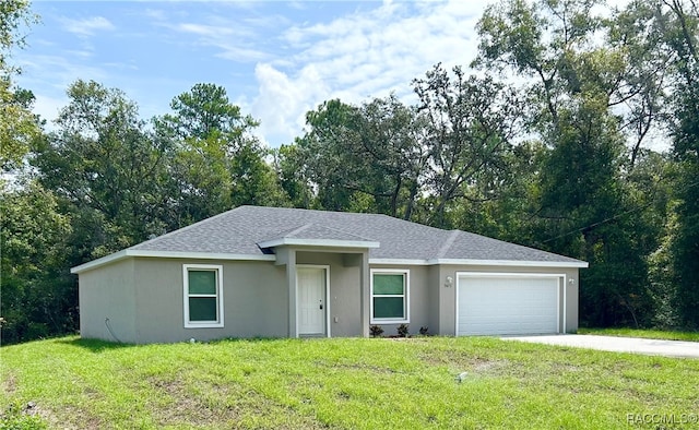 ranch-style home featuring a garage and a front yard