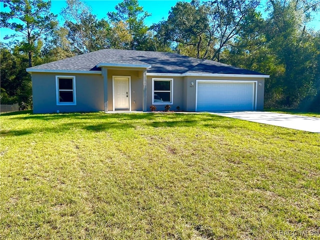 ranch-style house featuring a garage and a front lawn