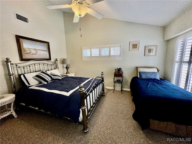 carpeted bedroom featuring ceiling fan, a textured ceiling, and vaulted ceiling