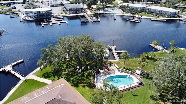 birds eye view of property with a water view