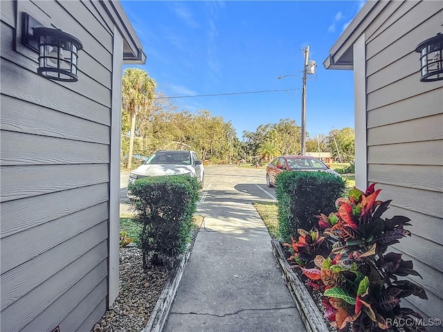 view of road with driveway