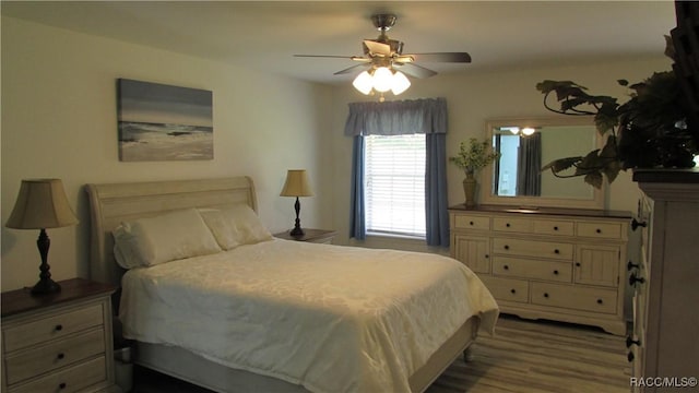 bedroom featuring ceiling fan and wood finished floors