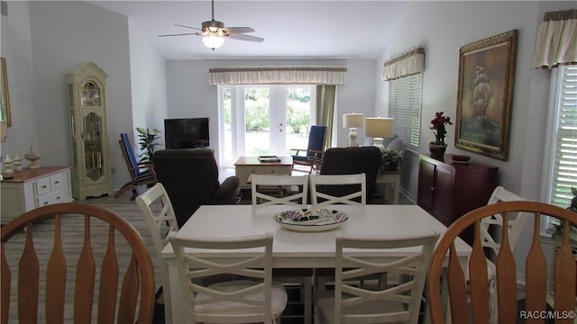 dining area with ceiling fan and french doors